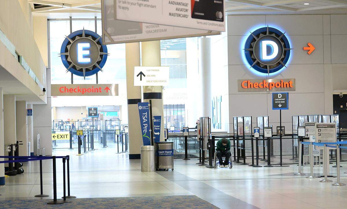 The E and D checkpoints at Charlotte Douglas International Airport are silent on Sunday, January 16, 2022 as a wintry mix blanketed the area.
