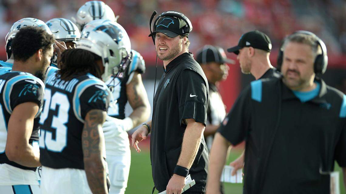 Carolina Panthers special teams coordinator Chase Blackburn, center, was let go Tuesday.