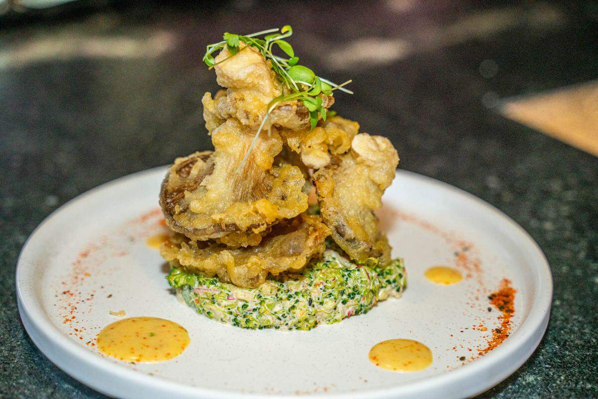 PARA’S TEMPURA has oyster mushrooms, radish, broccoli slaw and togarashi aioli.