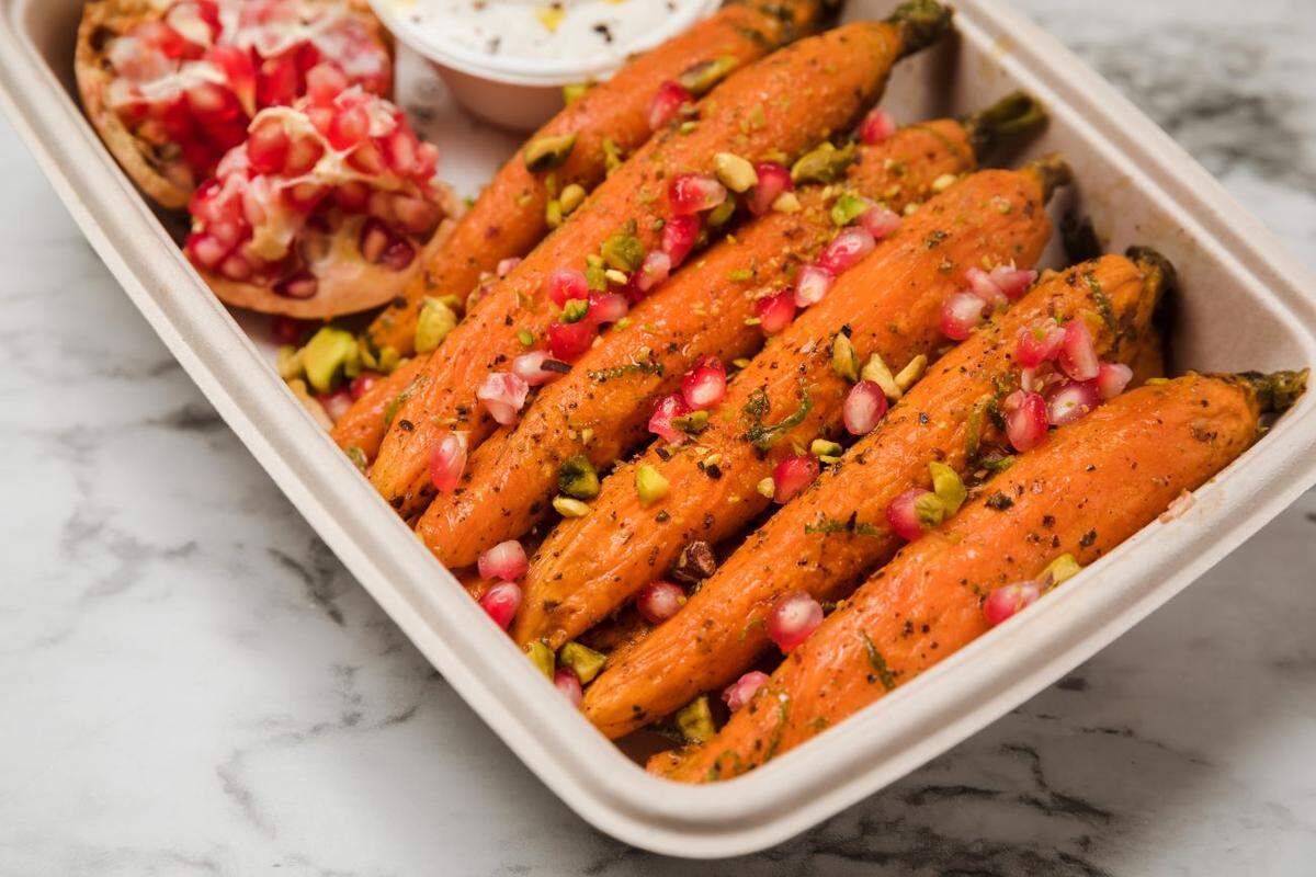 Copain is offering sides like roasted carrots with tahini and pomegranate seeds. 