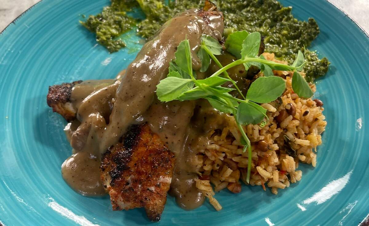 Smothered sea bass with vegetable purloo from Jimmy Pearls.