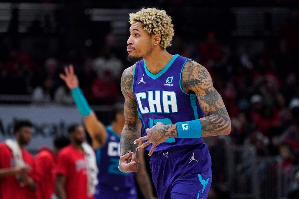 Charlotte Hornets guard Kelly Oubre Jr., reacts after a three-point basket during the second half of an NBA basketball game against the Chicago Bulls in Chicago, Friday, April 8, 2022. The Hornets won 133-117. (AP Photo/Nam Y. Huh)