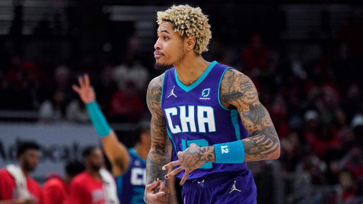 Charlotte Hornets guard Kelly Oubre Jr., reacts after a three-point basket during the second half of an NBA basketball game against the Chicago Bulls in Chicago, Friday, April 8, 2022. The Hornets won 133-117. (AP Photo/Nam Y. Huh)
