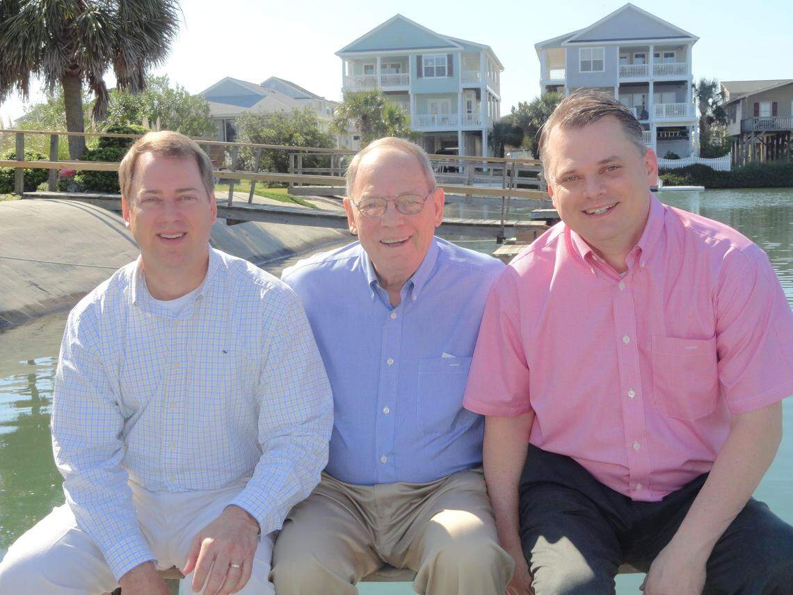 Bill Bauer (center) is flanked by his two sons, Hank (left) and Greg, during a family vacation at Ocean Isle, N.C., in 2012. Bauer died of the COVID-19 virus on April 16, 2020.