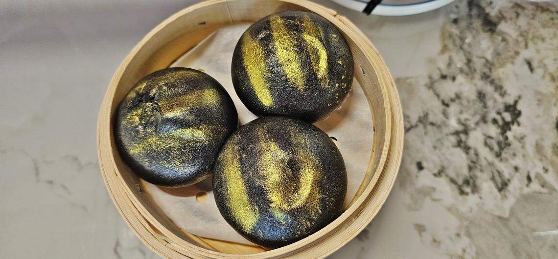 Black golden lava custard buns at The Imperial Treasure.