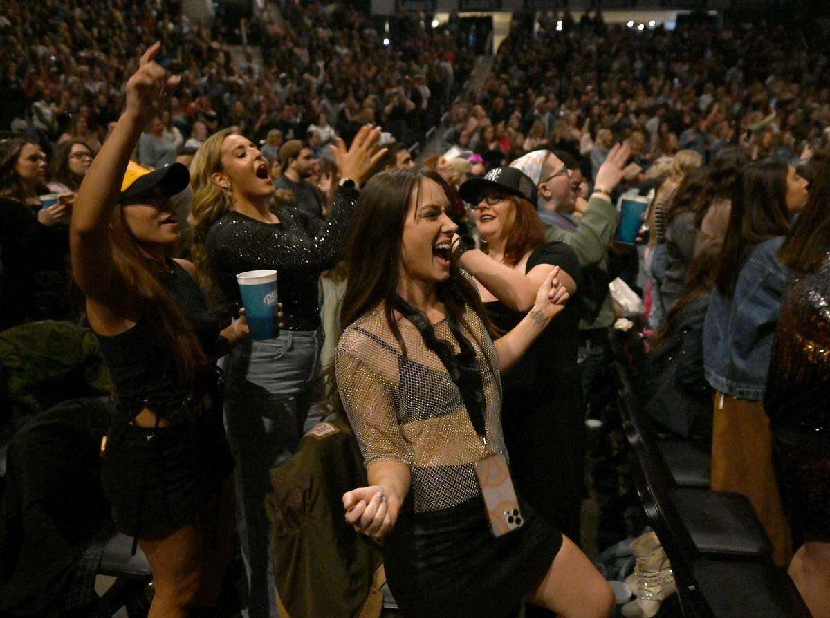 Fans react as Kelsea Ballerini takes the stage at Spectrum Center on Thursday night.