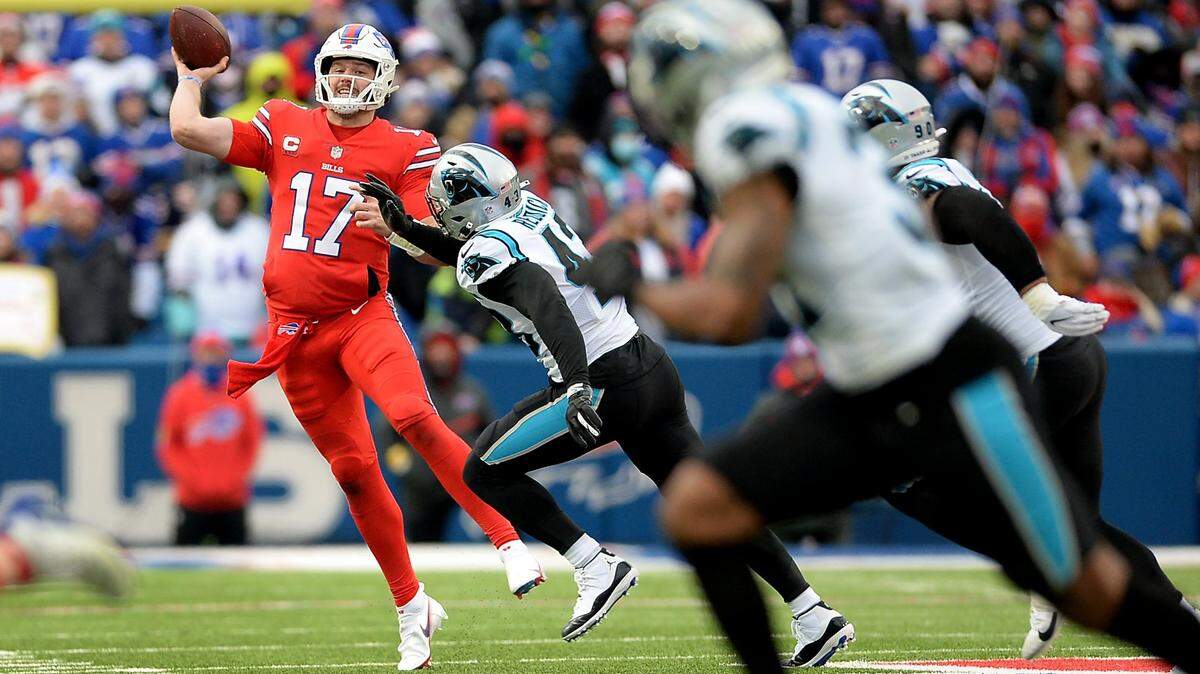 Buffalo Bills quarterback Josh Allen, left, played against Carolina in December 2021 -- a 31-14 win for Buffalo. But Allen won’t play Friday night in Charlotte when the two teams play an NFL exhibition.