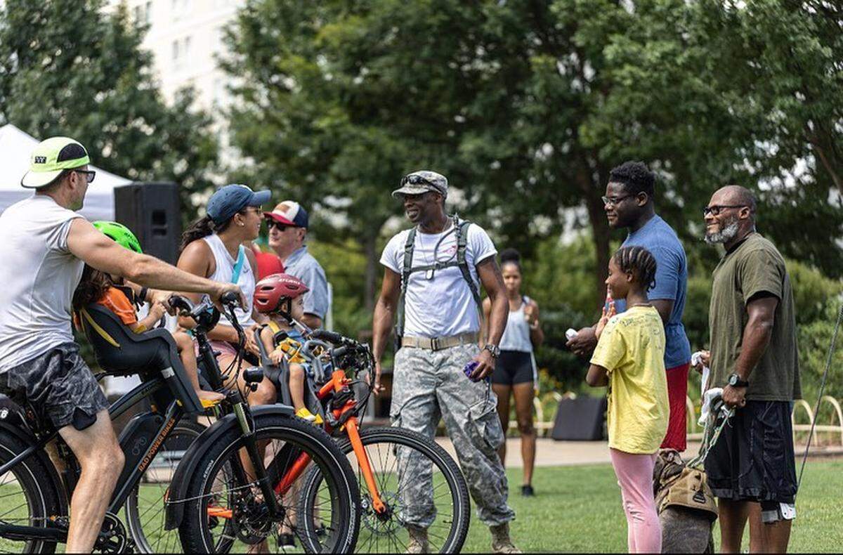 People gather to bring awareness to veteran suicide during the U.S. Veterans Hall of Fame’s fourth annual Walk to Fight Suicide on Saturday Aug. 6, 2022. The event saw lower turnout than previous years due to a parking issue.