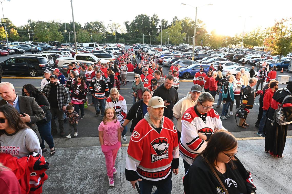 Charlotte Checkers fans line up to enter Bojangles Coliseum in Charlotte, NC on Friday, October 18, 2024. The Charlotte Checkers hosted the Cleveland Monsters in the home opener.