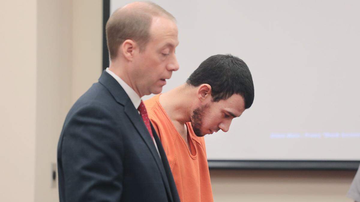 Christopher Mendez hangs his head as his attorney Phil Smith talks to the judge Tuesday at a hearing in York.
