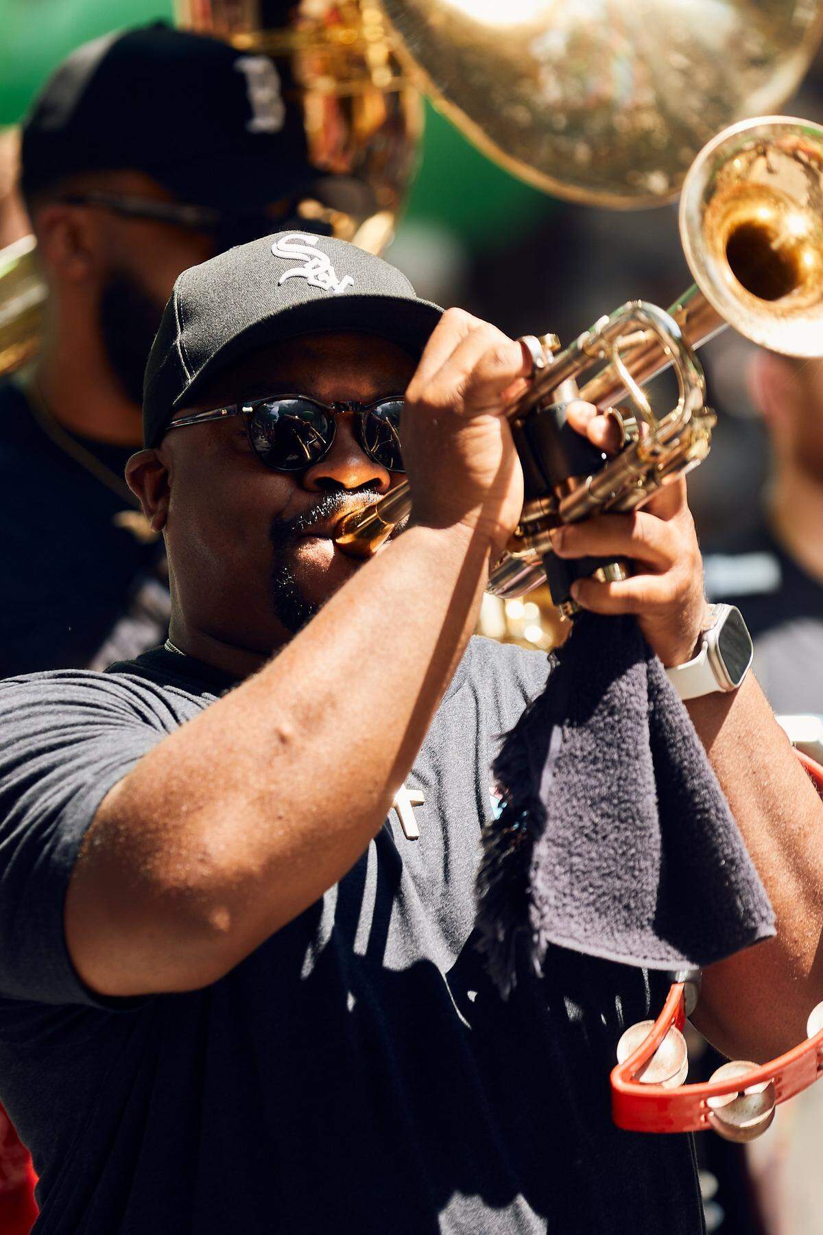 A trumpeter for the American Airlines float moves through the parade route during the 25th Charlotte Pride Parade in uptown Charlotte on August 17, 2025.