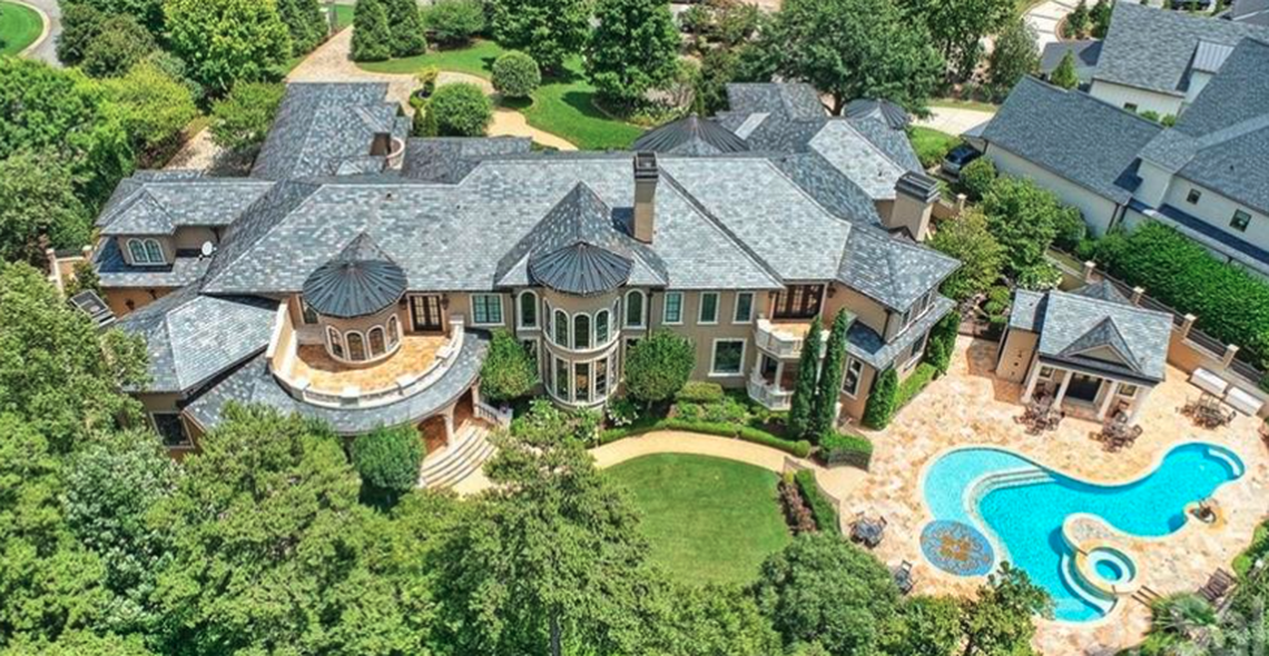 Robert and Sonya Stevanovski’s 15,000-square-foot Lake Norman mansion graces the waterfront on Harbor Light Boulevard in The Peninsula community in Cornelius.  