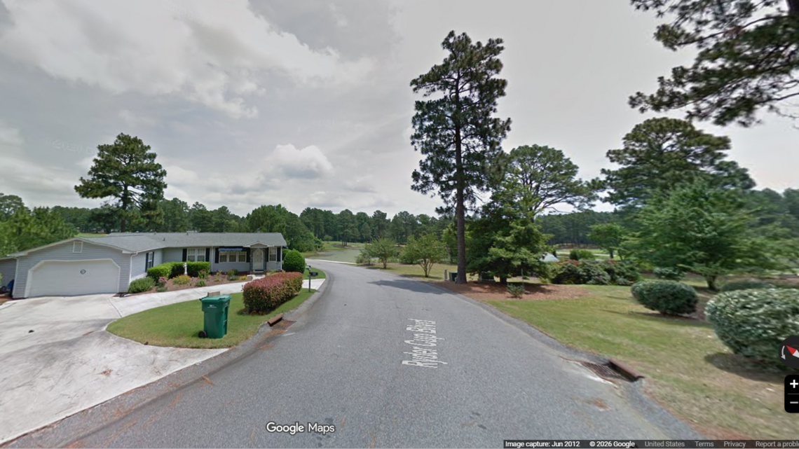 3 killed at home in NC golf community. A family member is charged, sheriff says