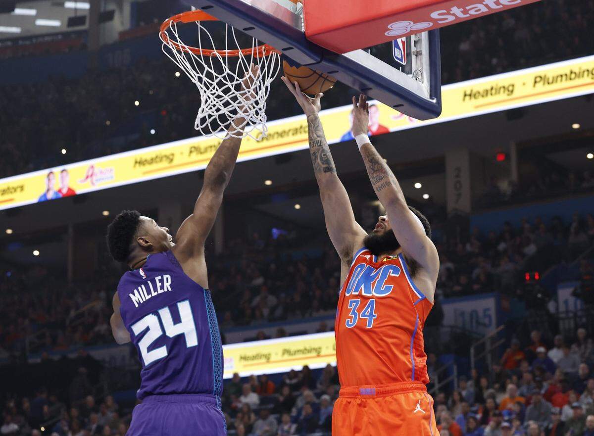 Oklahoma City Thunder forward Kenrich Williams (34) shoots as Charlotte Hornets forward Brandon Miller (24) defends during the second quarter at Paycom Center.