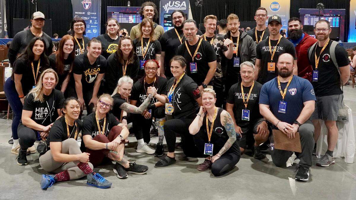 Athletes from Heavy Metal Barbell Club in Charlotte pose for a group photo at the USAW Masters World Championships at Daytona Beach, FL on Saturday, December 6, 2025.