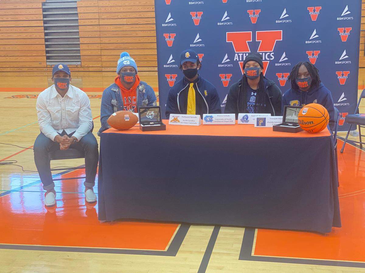 Vance High School had three football players and two girls basketball players sign Wednesday. From left: Avarion Cole (NC A&T); Power Echols (UNC); Nathaniel Spindle (N.C A&T); Amiyah Moreland (basketball, ODU); Tanajah Hayes (basketball, Florida International)
