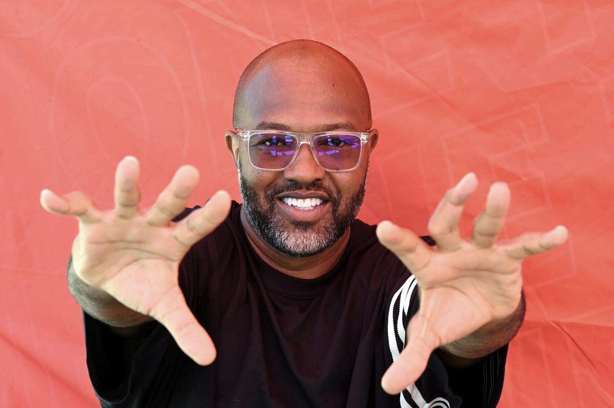 Former NC State Wolfpack and NFL wide receiver Torry Holt’s fingers tell the tale of having played football.