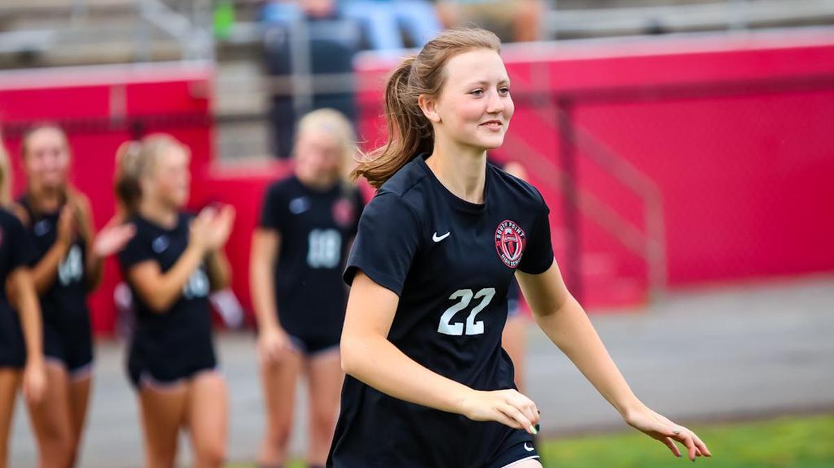 Hannah Thovtrup runs out to celebrate with her teammates after their win over West Charlotte