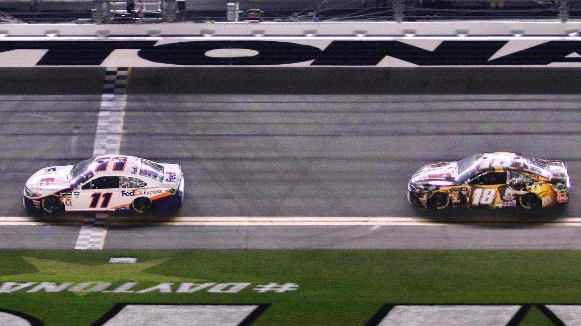 Denny Hamlin (11) beats Kyle Busch (18) to the finish line to take the checkered flag at the Daytona 500, at Daytona International Speedway last year. NASCAR is changing the lengths of stages in 16 races this season.