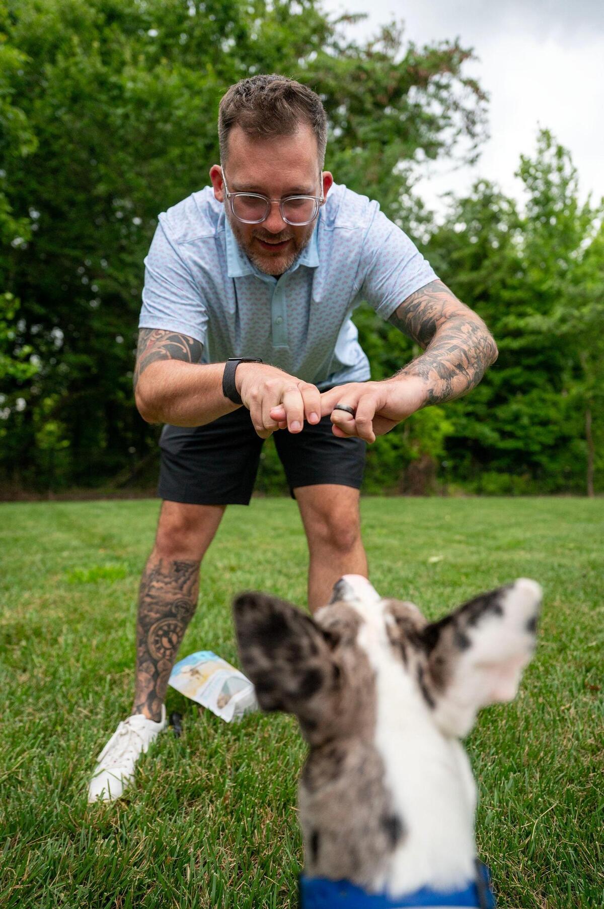 Foster parent Andrew Boblit works with Frankie. Boblit and his wife Sarah Ziarko have been teaching Frankie American Sign Language every day.