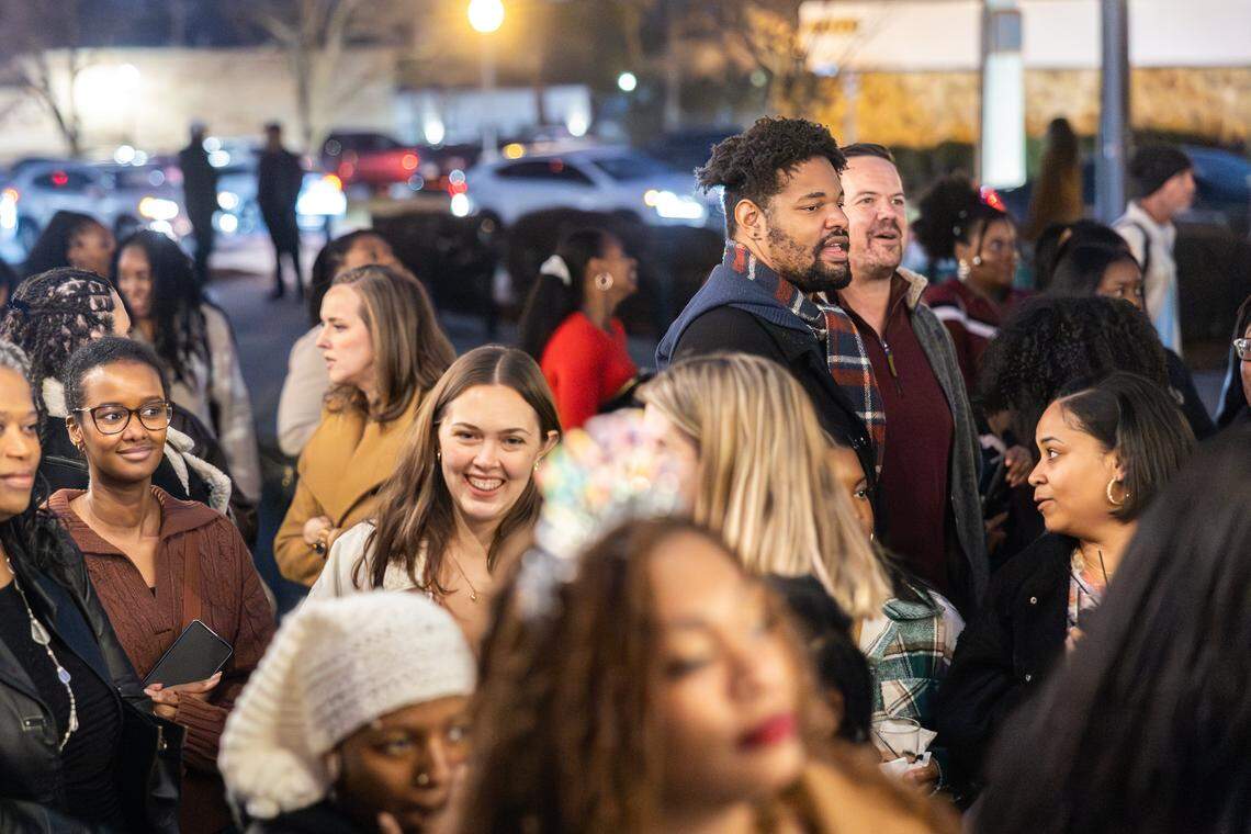 Darius Witherspoon, back, standing at 7-feet tall, towers over the crowd at the Tall Tour event at Brewers At 4001 Yancey in Charlotte, N.C., on Saturday, December 6, 2025.