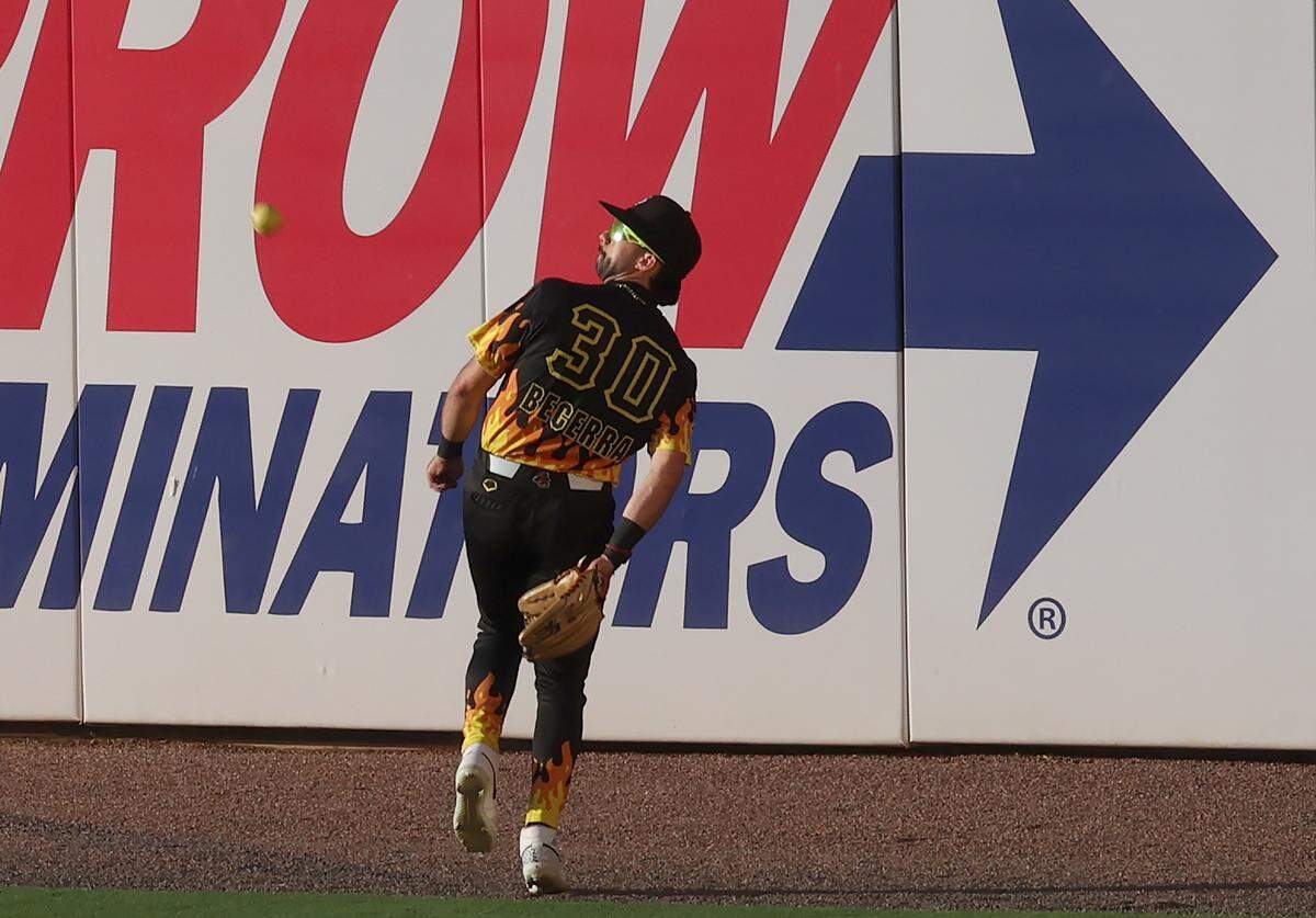 Firefighters centerfielder Armando Becerra catches a deep fly behind his back during action against the Texas Tailgaters at Truist Field in Charlotte, NC on Thursday, June 4, 2026. Banana Ball action returned to the Queen City with the Texas Tailgaters battling the Firefighters.