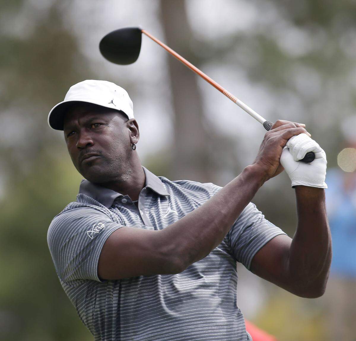 NORTH LAS VEGAS, NV - APRIL 04: NBA legend Michael Jordan hits a tee shot during ARIA Resort & Casino's 13th Annual Michael Jordan Celebrity Invitational at Shadow Creek on April 4, 2014 in North Las Vegas, Nevada. (Photo by Isaac Brekken/Getty Images for Michael Jordan Celebrity Invitational)