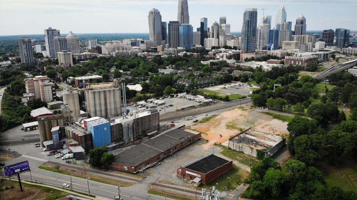 A mostly vacant, 5-acre lot at the corner of West 9th and Johnson streets sits close to a large flour mill. Both are close to uptown and Interstate 277. A developer has proposed to build 82 townhomes, leading to concerns from the mill.