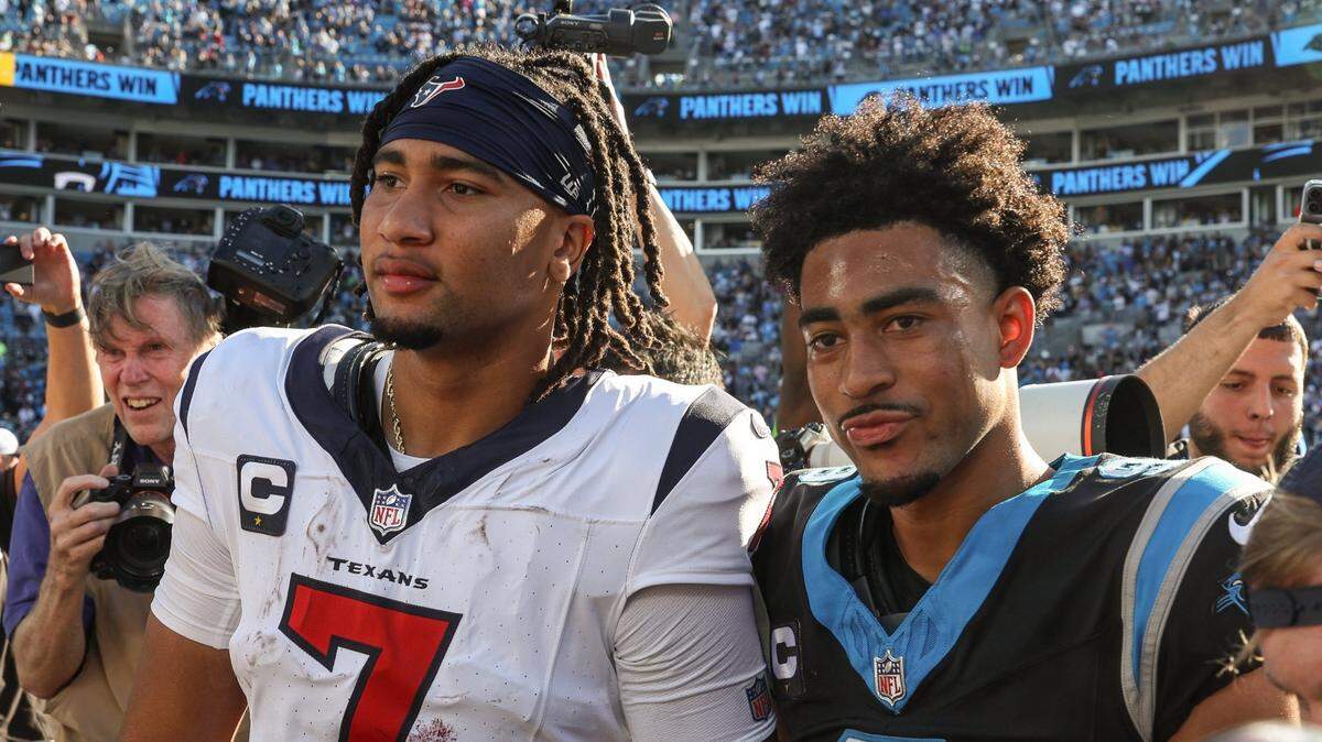Houston Texans quarterback C.J. Stroud, left, poses with Carolina Panthers quarterback Bryce Young after the game at Bank of America Stadium on Sunday, October 29, 2023. Young and the Panthers got their first win of the season over the Texans, 15-13.