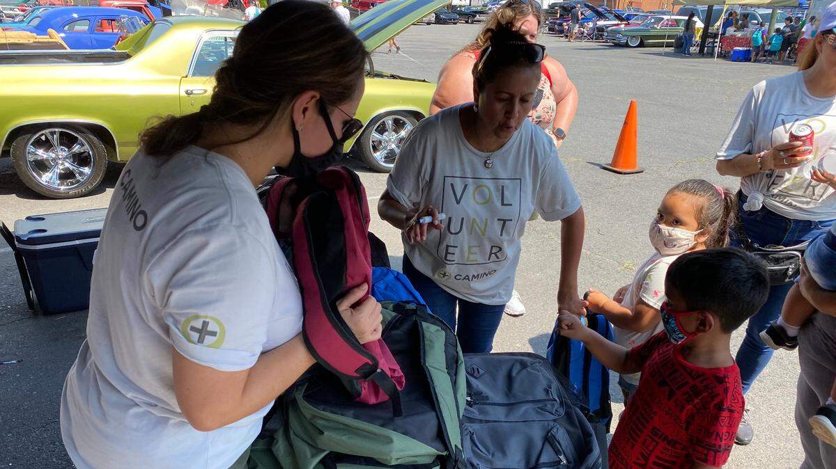 The Camino Health Center hosted a school supplies giveaway event in 2021 in Charlotte. In Charlotte-Mecklenburg Schools, a record-high number of English language learners are enrolled. The Camino center serves Latino families across the region, many of whom utilize language translation services to connect with the school system.