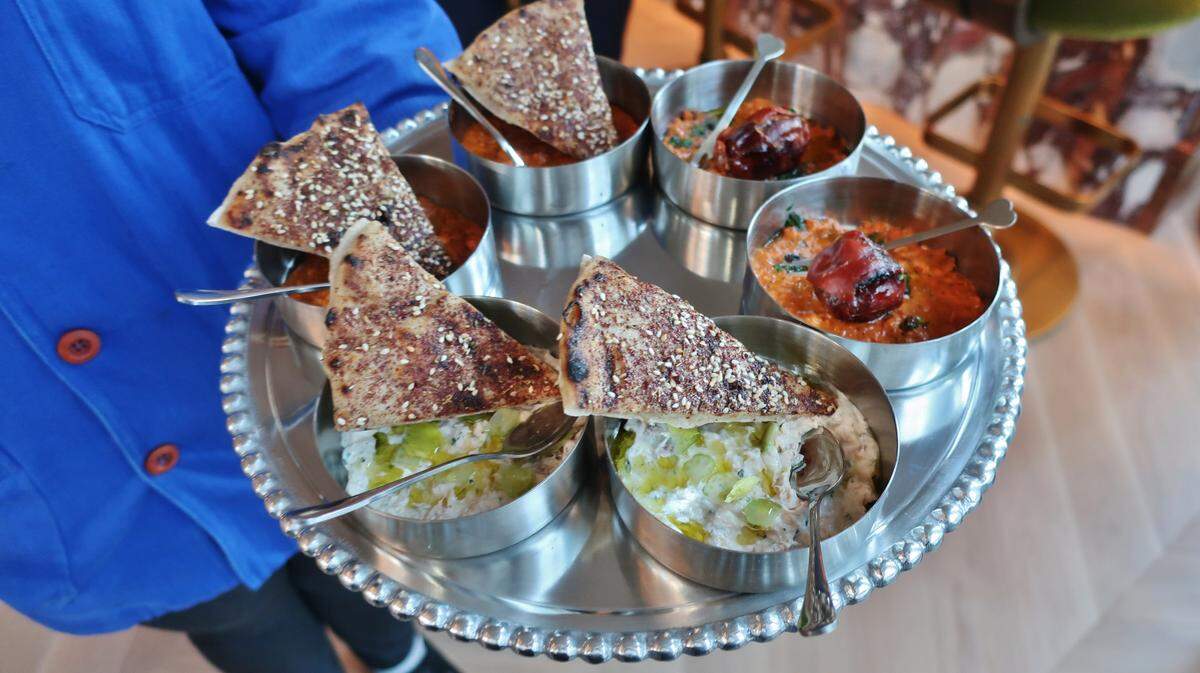 Deviled taramasalata — a smoked North Carolina tuna spread — is served at Albertine with za’atar man’oushe, a Lebanese-style flatbread. Another meze on the menu is stuffed dates with chorizo, peanut muhammara and country ham.