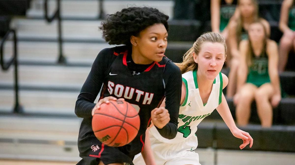 South Meck’s Shariah Gaddy (23) brings the ball up the court in Tuesday’s game with rival Myers Park