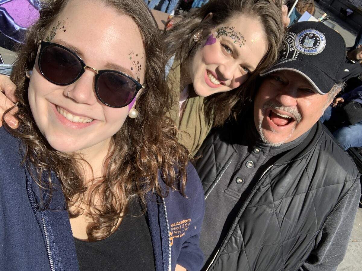 Minister and musician Landon Spradlin, shown at the 2020 Mardi Gras with his daughters Naomi, left, and Jesse, collapsed in Concord on the drive home and later died of COVID-19.