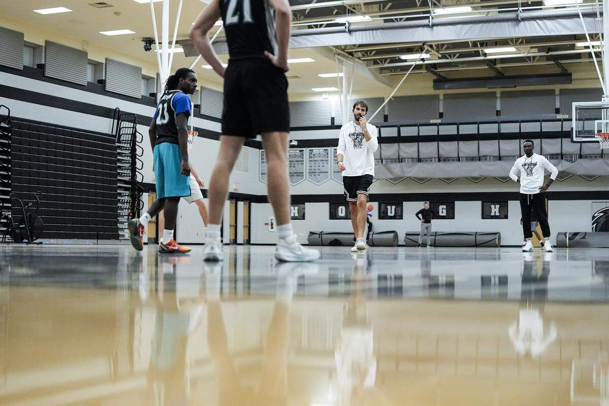 Head basketball coach Beau Maye looks on during a boys varsity basketball practice at Hough High School, Monday, Nov. 10, 2025, in Cornelius, N.C.