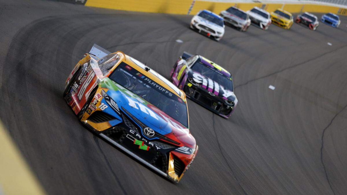 LAS VEGAS, NEVADA - SEPTEMBER 27: Kyle Busch, driver of the #18 M&M’s Toyota, leads a pack of cars during the NASCAR Cup Series South Point 400 at Las Vegas Motor Speedway on September 27, 2020 in Las Vegas, Nevada. (Photo by Brian Lawdermilk/Getty Images)