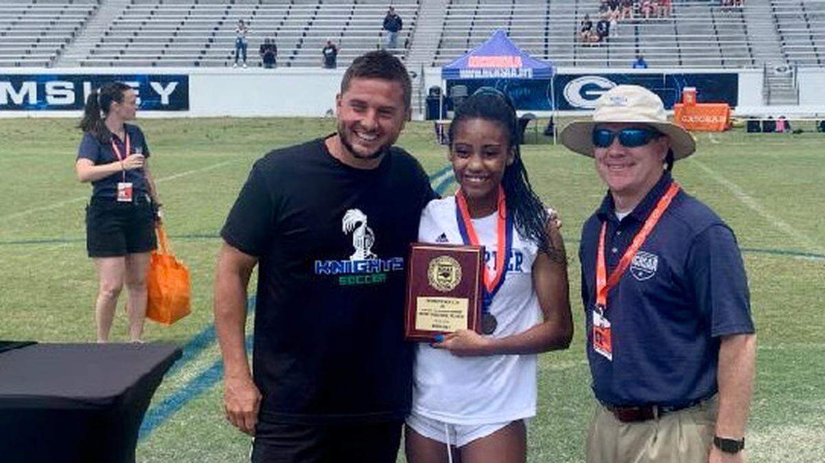 Lake Norman Charter’s Asha Means (center) is the NC Gatorade player of the year