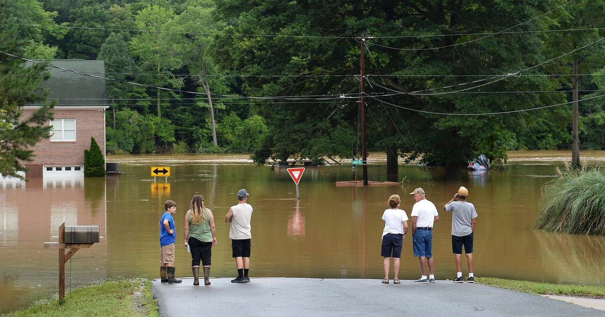After a weekend of heavy rains, residents along Riverside Drive on Mountain Island Lake had to evacuate due to flooding. Some of them survey the high waters June 10. Also, a dock with boats attached broke loose and became jammed against the supports for the Hwy 16 bridge that crosses the lake into Gaston County. Boats were being towed to the Riverbend Access ramp.