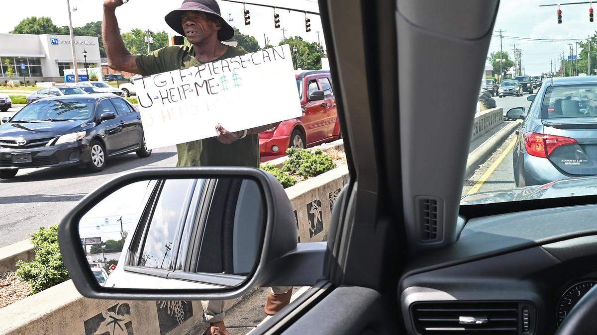 Panhandlers’ plight: They’ve lived at this intersection for years. Is there any way out?