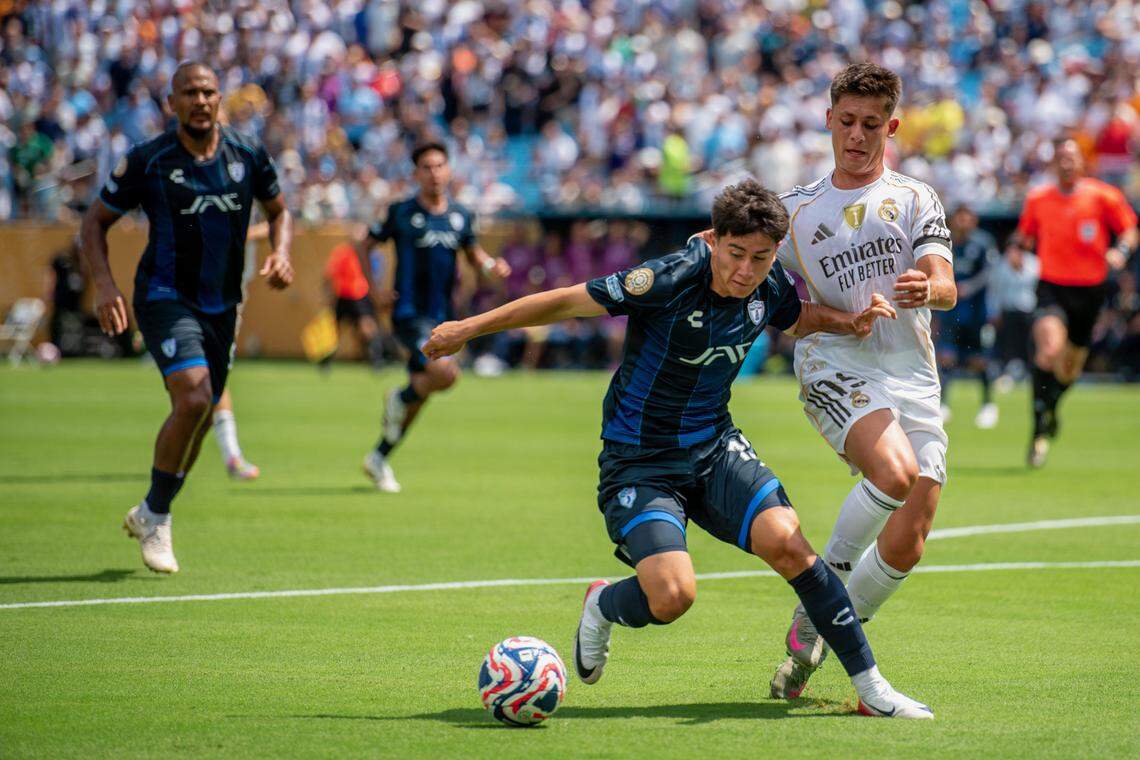 Arturo González of Panchuca dribbles around a Real Madrid player during the Club World Cup Sunday, June 22, 2025 in Charlotte at Bank of America.