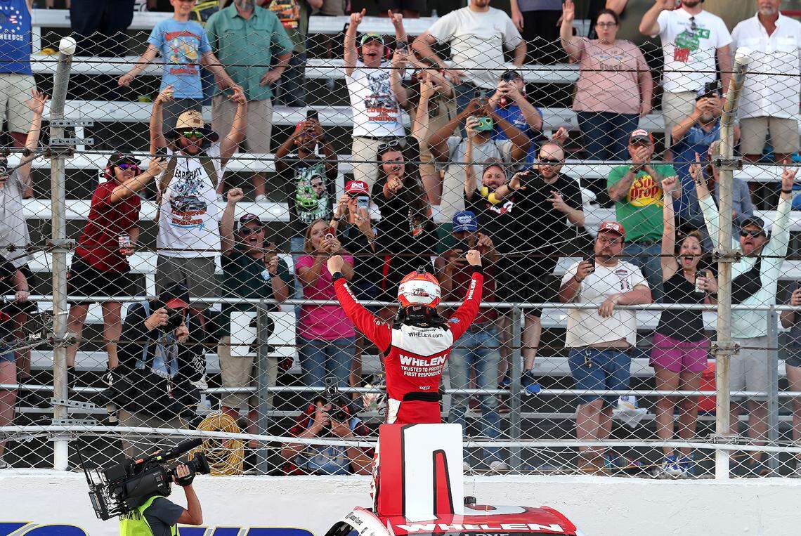 NASCAR Xfinity Series driver Jesse Love celebrates winning the North Carolina Education Lottery 250 with the fans at Rockingham Speedway on Saturday, April 19, 2025.