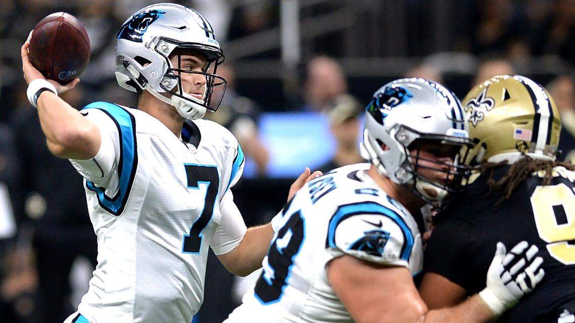 Carolina Panthers quarterback Kyle Allen, right, stands in the pocket to pass to a receiver during first quarter action against the New Orleans Saints at the Mercedes-Benz Superdome in New Orleans, LA. on Sunday, December 30, 2018.