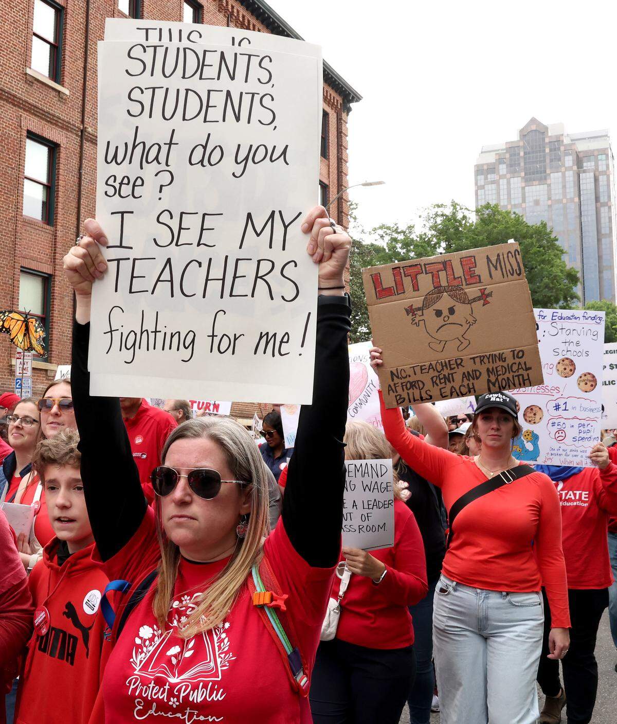 Signs, signs, signs were everywhere as teachers rallied at the Government Complex in Raleigh.