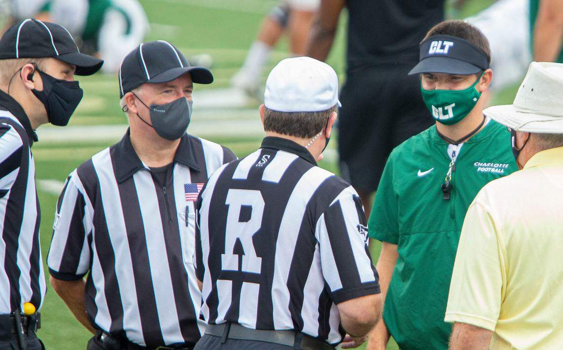 49ers head coach Will Healy talks with the referees before the team scrimmage starts at Richardson Stadium in Charlotte, NC on Saturday, August 15, 2020.