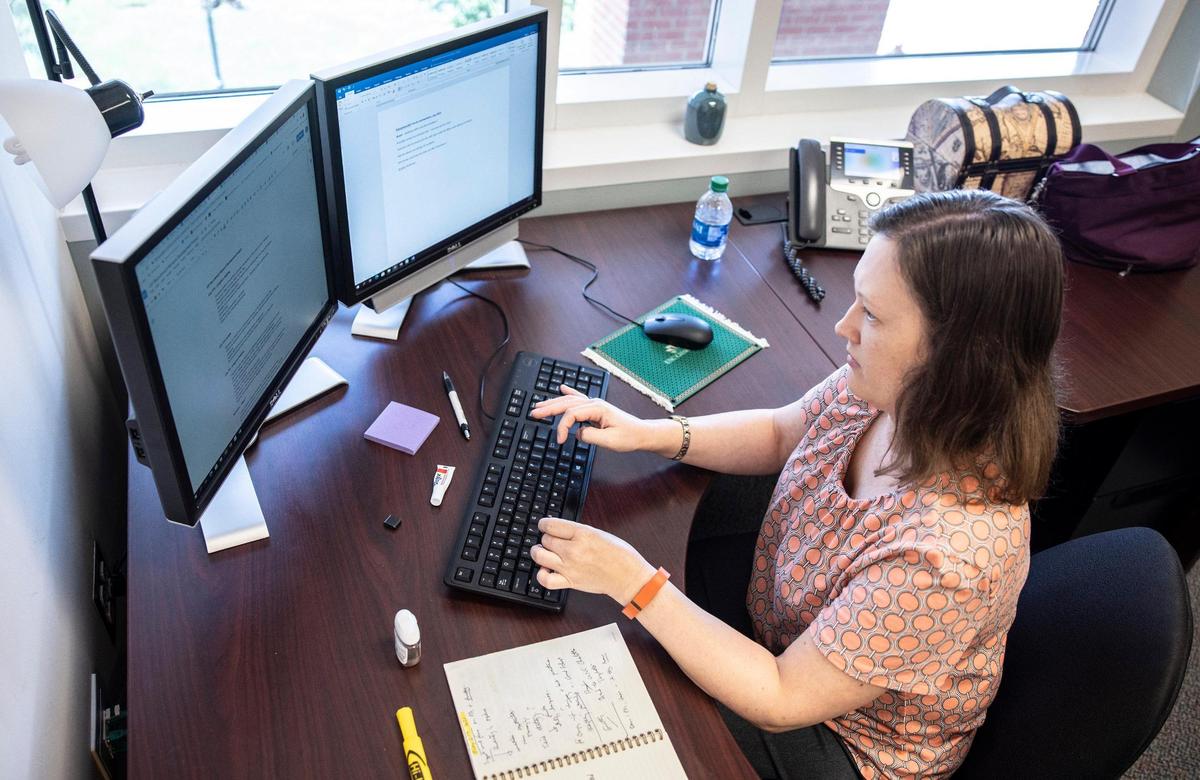 Ellie Haag works at UNC Charlotte in Charlotte, N.C., on Tuesday, July 27, 2021.