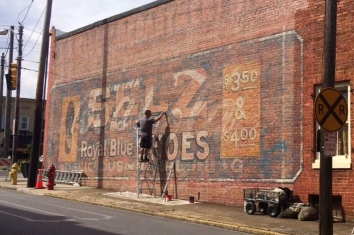 The Town of Mooresville restored its historic wall signs, hiring Brushcan Custom Murals to revive the icons through a painstaking process that took 155 hours over 17 days.