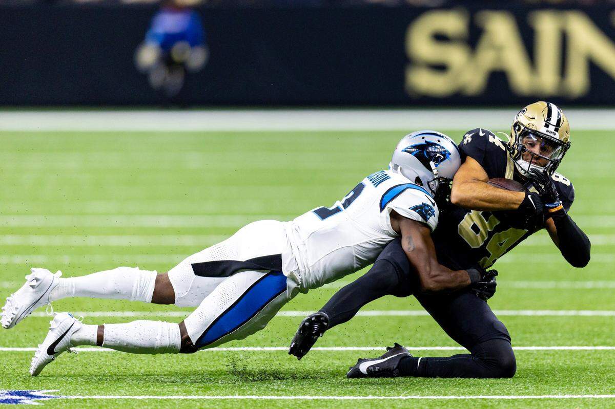 Carolina Panthers cornerback Michael Jackson (2) tackles New Orleans Saints wide receiver Mason Tipton (84) during the first half at Caesars Superdome.