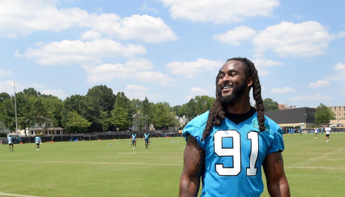 Pat Jones II, #91, a Panthers outside linebacker, joked with teammate Bryce Young after practice. The Carolina Panthers, in their second week of organized team activities, ran through drills on Tuesday, June 3, 2025 at their practice facility in uptown Charlotte.