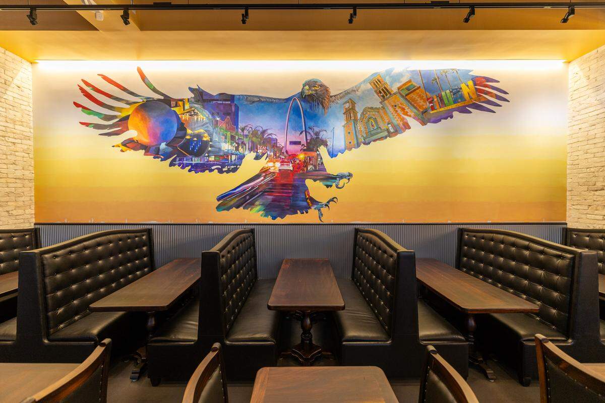 A Nick Napoletano mural decorates the dining room at the new Rio 150 location in Moorseville.