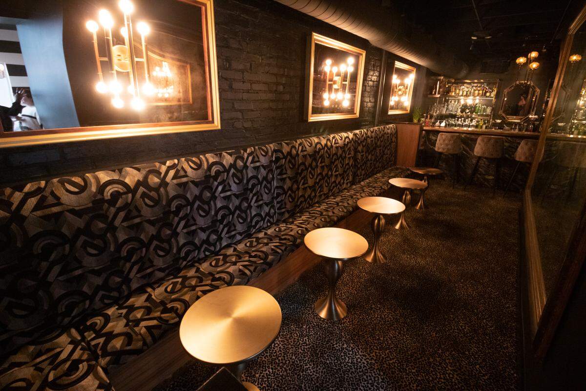 The Tattoo side of Kiki and Tattoo in Plaza Midwood is a dark lounge with limited seating for a VIP feel. The bar specializes in liquor only cocktails.
