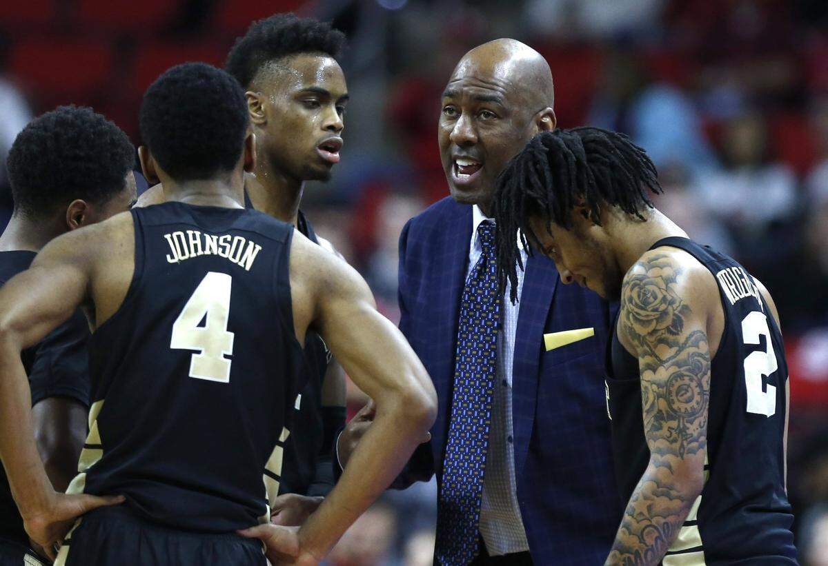 Wake Forest head coach Danny Manning talks with his team, including from left, Brandon Childress (0), Torry Johnson (4), Isaiah Mucius (1) and Sharone Wright Jr. (2) during the second half of N.C. State’s 94-74 victory over Wake Forest at PNC Arena in Raleigh, N.C., Sunday, Feb. 24, 2019.